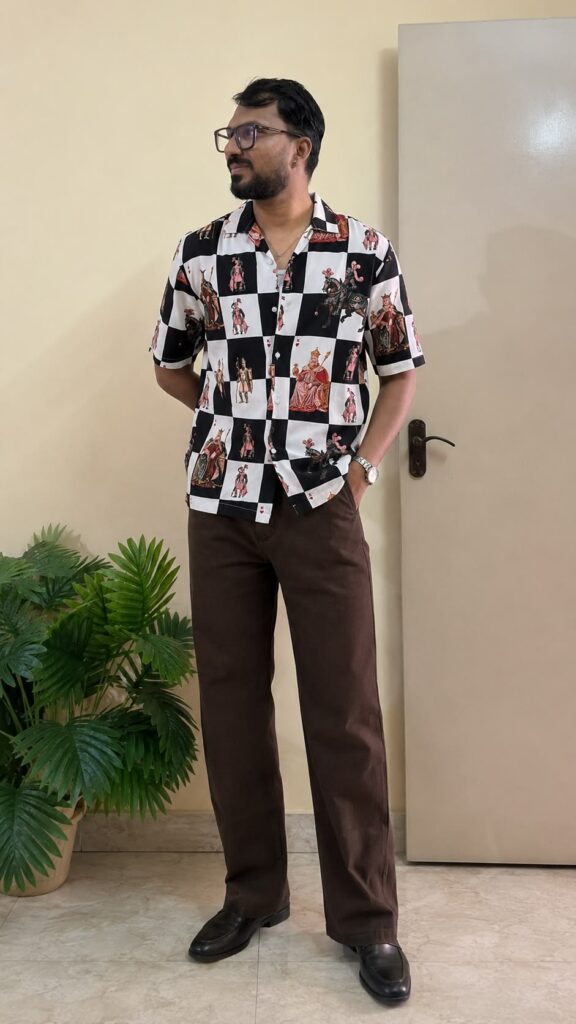 Black graphic printed opaque Casual shirt ,has a cuban collar, button placket, na pocket, short regular sleeves, straight hem