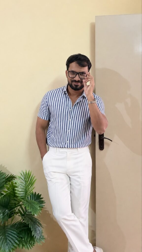 Blue Vertical Stripes Printed Opaque Casual shirts ,has a Spread Collar, Button Placket, Short Regular Sleeves, Curved hem