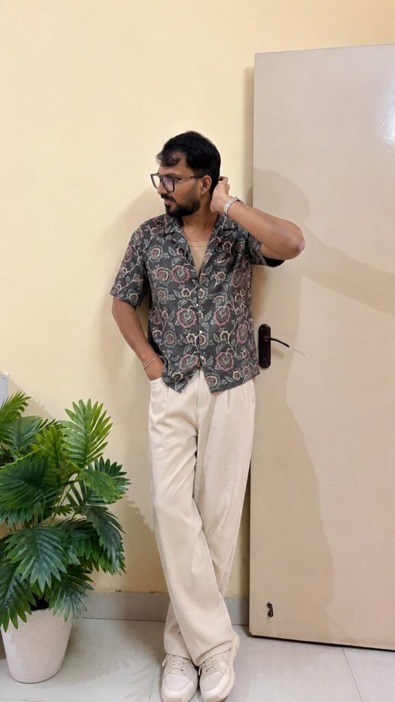 Grey, pink and green floral printed opaque casual shirt ,has a cuban collar, button placket, 1 patch pocket, short regular sleeves, straight hem.