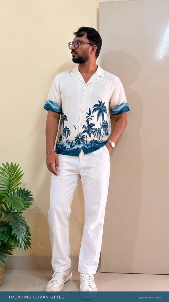 Man wearing a tropical palm printed Cuban collar shirt in a casual outdoor setting