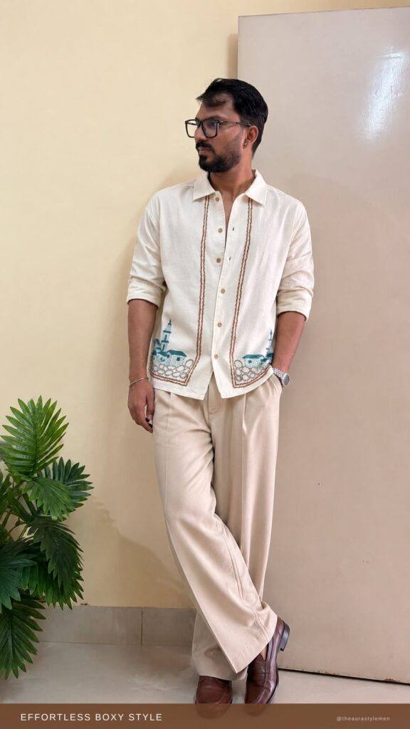 Man wearing a cotton boxy fit casual shirt with spread collar in a relaxed pose