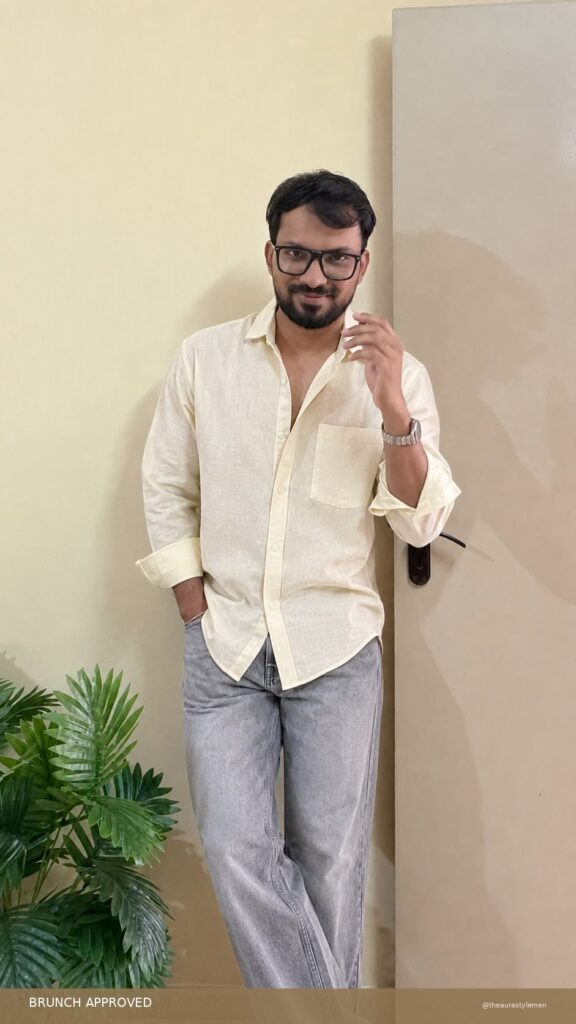 Men’s butter beige solid shirt styled with light-wash jeans for brunch