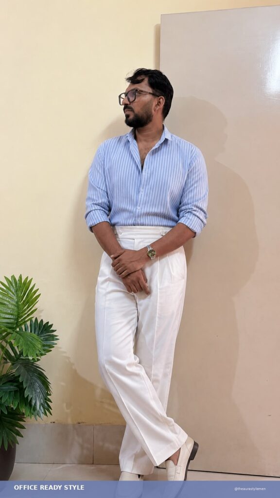 Light blue striped men's shirt with white trousers for office casual style