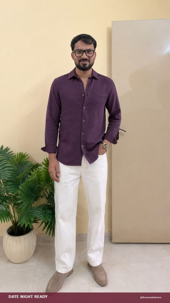 Man wearing a plum textured shirt with white trousers and loafers