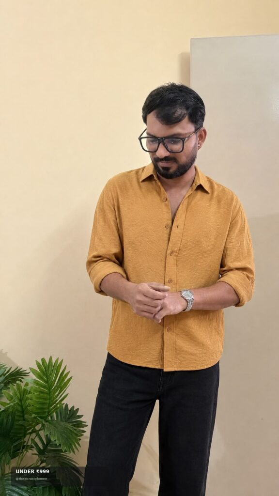 Mustard solid men’s shirt styled with black jeans under ₹999