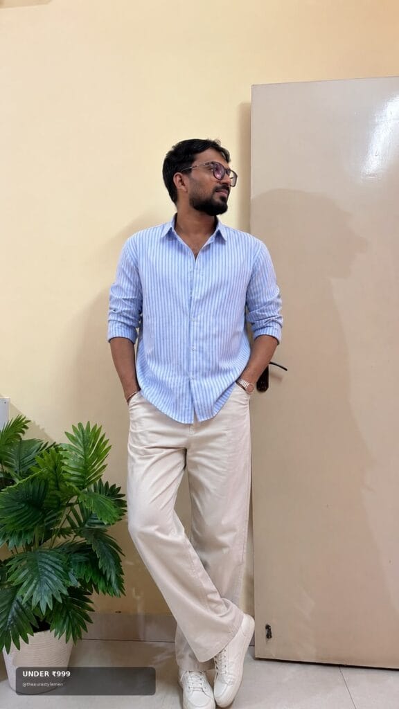 Affordable light blue striped shirt styled with white trousers