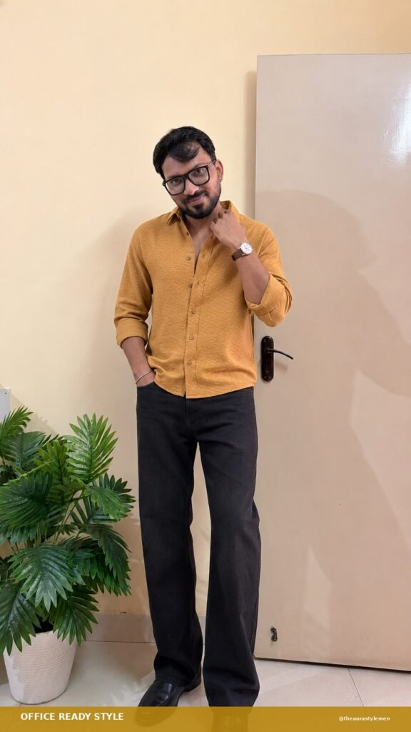 Man wearing a mustard textured shirt with black jeans