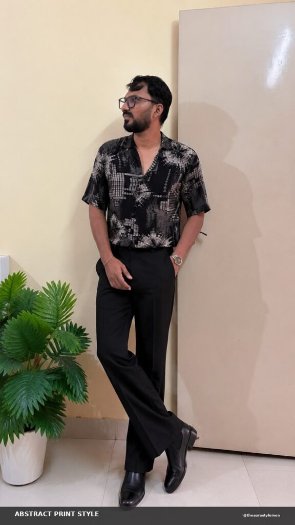 Black abstract printed shirt styled with black trousers for men