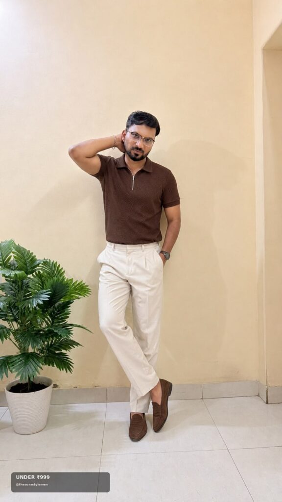 Man styling a brown textured polo with ivory trousers and brown loafers.