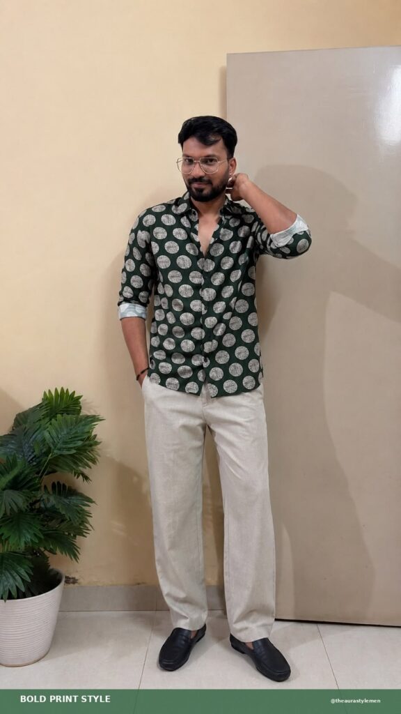 Vertical Pinterest Pin featuring a man wearing a green and grey polka dot printed casual shirt with a spread collar and long sleeves. The outfit is styled for a smart-casual weekend look with a clean, modern menswear aesthetic.