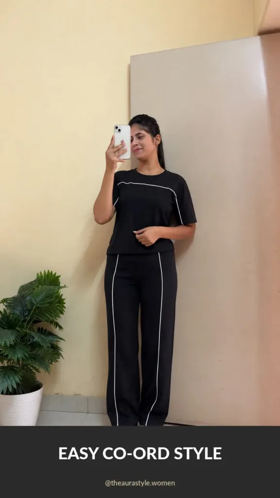 Woman wearing a black relaxed co-ord set with white piping and sneakers — Black Premium Co-ord Set Outfit for Women