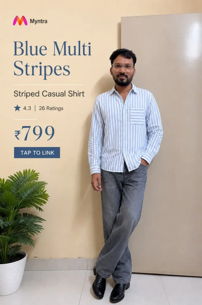 Man wearing a blue and white vertically striped casual shirt with grey jeans and black shoes, featuring a Myntra product pin with ₹799 price and