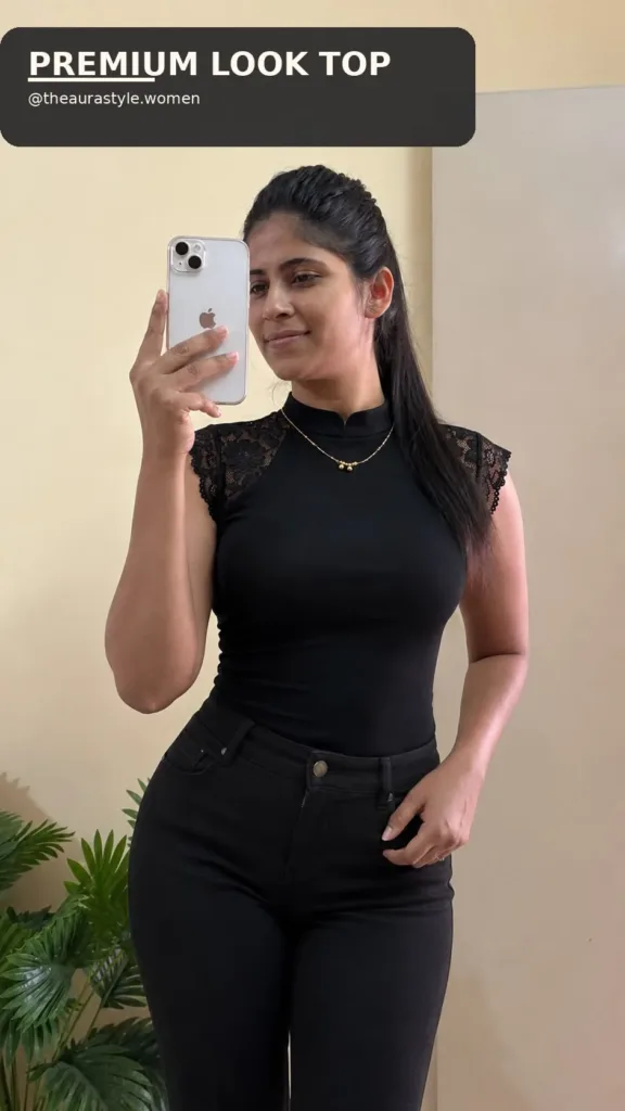 Woman wearing a fitted black high-neck lace top with black jeans. — Black Lace Jeans Outfit for Women