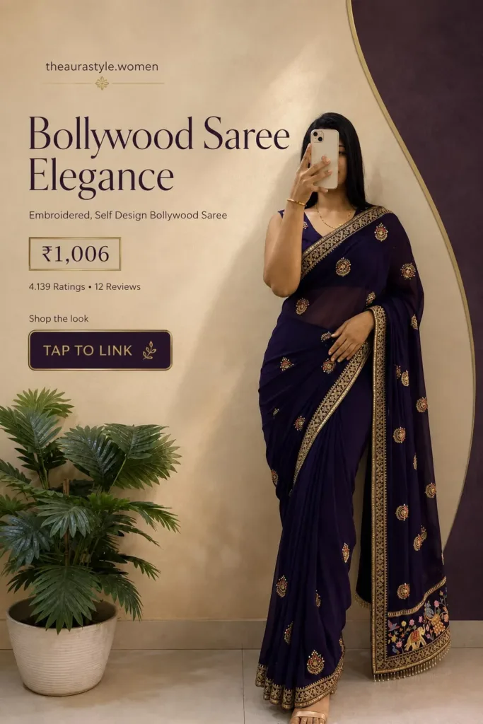 Woman wearing a deep purple embroidered Bollywood saree with ornate gold border detailing, styled in an elegant minimal fashion setting