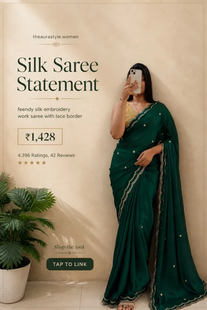 Woman wearing a deep emerald green feendy silk embroidery saree with decorative lace border and contrasting blouse. — Emerald Green Saree Outfit