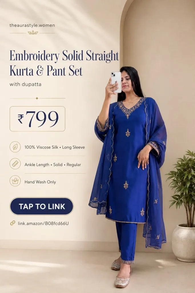 Woman wearing a royal blue embroidered straight kurta with matching ankle-length pants, sheer embroidered dupatta and embellished flats